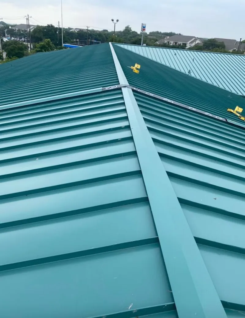 Green commercial metal roof ridge and valley for Metal Roof Repair in Winchendon